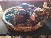 Dog bed with stuffed animals