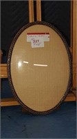 Antique oval brass frame with curved + 7 in by 5