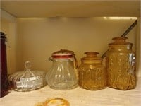 The shelf of assorted glassware