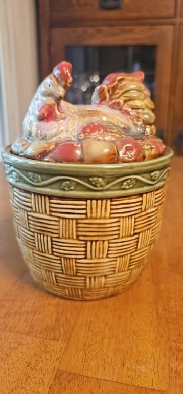 Hen nesting in basket vintage jar w/ lid.