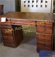 Kneehole desk with missing knobs and lots of