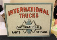 Metal International Trucks sign