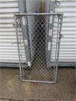 Metal chain link fence gate.