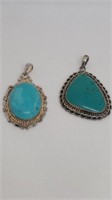 2 blue stone pendants unmarked