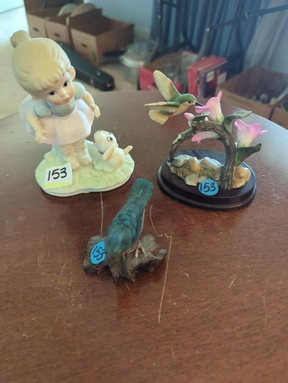 Figurines, girl with dog, hummingbird, and blue