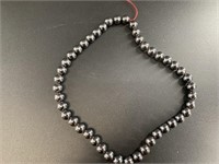 String of 1/4in hematite beads 16in long, no clasp