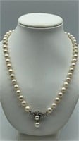 Cultured pearl and 14 karat diamond clasp necklace