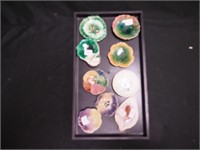 Nine butter pats mostly majolica, one is