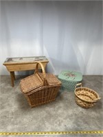 Assortment of wicker baskets and wood stool