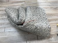 Grey area rug  (small tear)