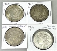 Four 1921 Morgan Silver Dollars.