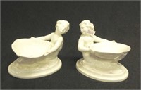 Pair of Royal Worcester white figural soap dishes