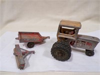 Vintage cast toy tractor with Hubley implements