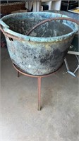 Copper kettle on stand