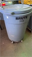 Brute garbage can on wheels with horse bedding