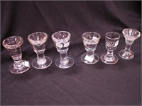 Six  post-prohibition shot glasses ranging