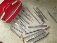 punches and chisels in red tote