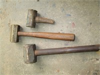 three  brass sledge hammers