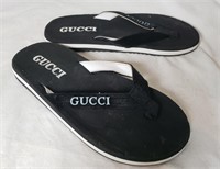 FLIP FLOPS THAT SAY GUCCI ON THEM