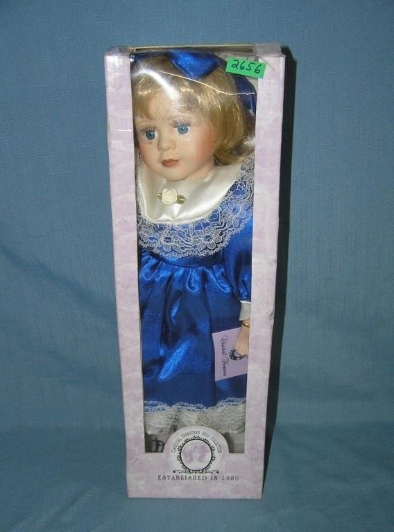 Porcelain doll in fancy blue dress