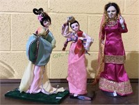 Three oriental dolls - tallest is measuring 14 1/2