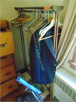 CLOTHES RACK AND ITEMS BELOW IT