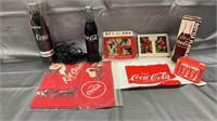 Coca-Cola collectibles, decks of cards, phone,