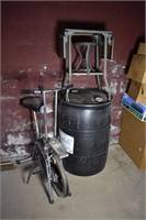Lot: Exercise bike, 55 gal plastic drum, metal tab