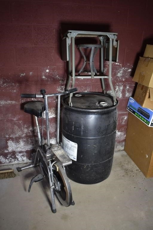 Lot: Exercise bike, 55 gal plastic drum, metal tab