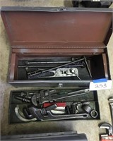 Two toolboxes with contents and pipe wrenches
