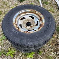 2- 235/75R15 Wheels on steel rims tires shot