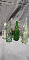 7 Vintage  Collectable Soft Drink Bottles.