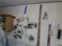 Contents of wall:  levels, clamps, coping saw,