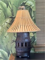 Converted Antique Wheel Hub Lamp With Tiki Shade