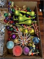 Box of bright colored christmas ornaments