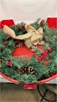 Wreath storage container with wreath