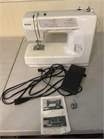 Kenmore portable sewing  machine. Book is from a
