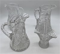 3 cut glass pitchers and a basket