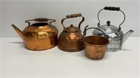 Vintage tea kettles in multiple metals includes