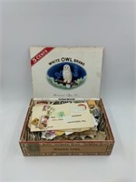 Vintage cigar box full of stamps