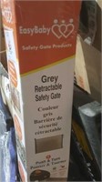 Grey retractable safety gate