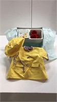 American girl raincoat sat with rain, coat hat,