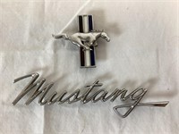 Two Ford Mustang Automotive Emblems