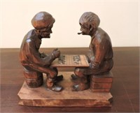 Carved wood "checker players" signed Paron