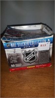 Box of hockey stickers opened