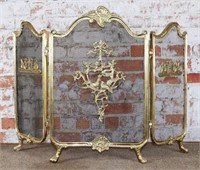 An Ornate Brass Fire Screen with scrolled cast