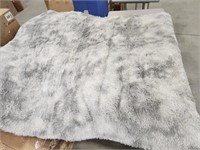 Grey shaggy Rug. Approximately 86 in. X 63 in.