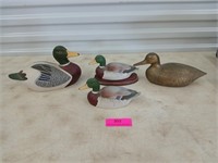 Three ceramic ducks by Andrea and one brass duck