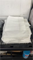 White bathroom floor mats and towel