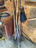 Group of yard tools (hoes, rake, shovel, axe)